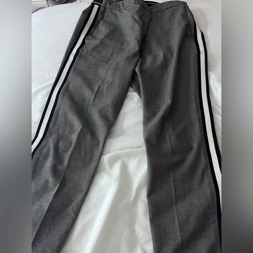 Grey woman’s dress pants with black and white side stripe